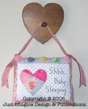 Mini pillow on heart peg